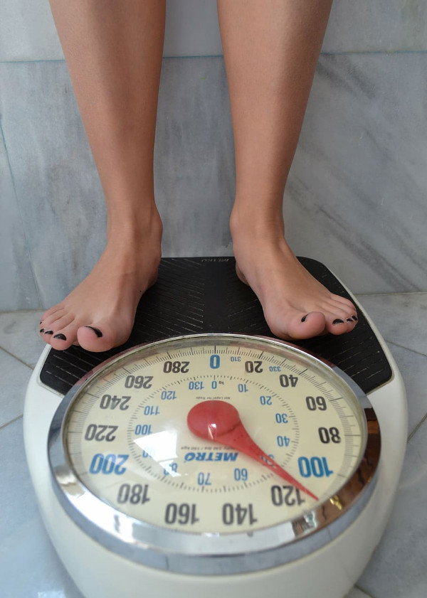 Woman Weighing Herself